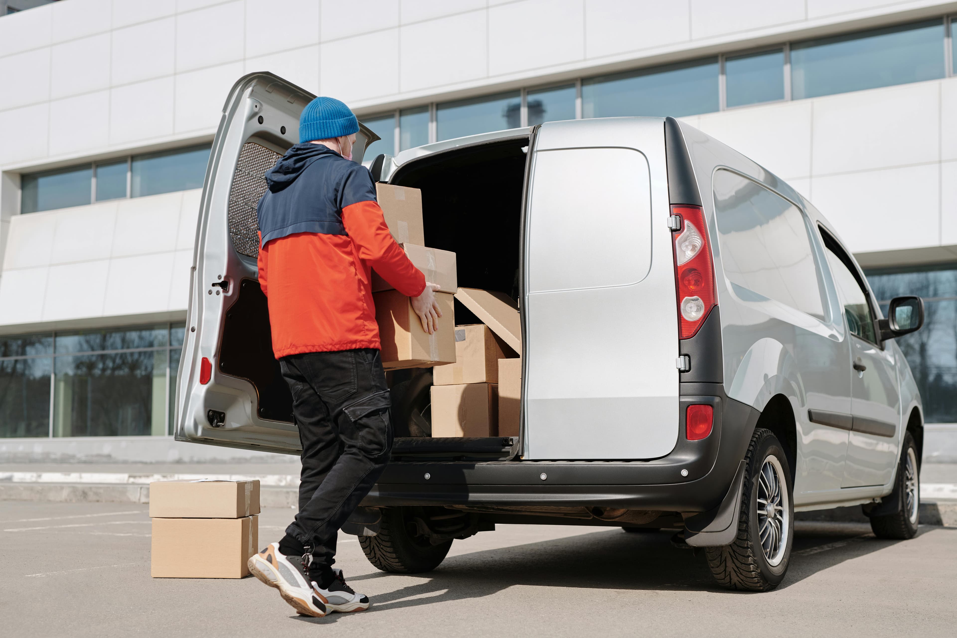 Royal Runs courier loading parcels into a van