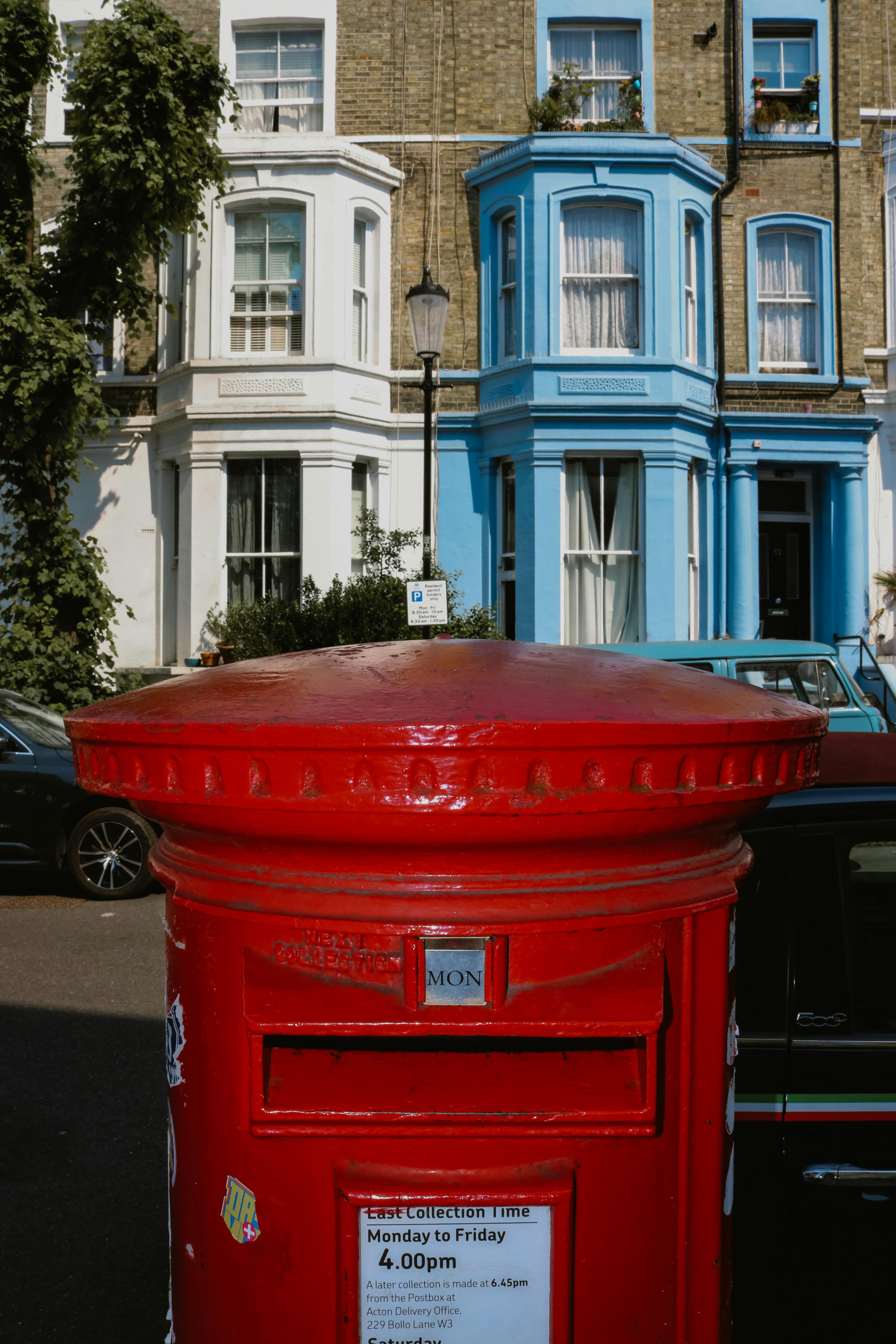 Classic UK postbox and London street